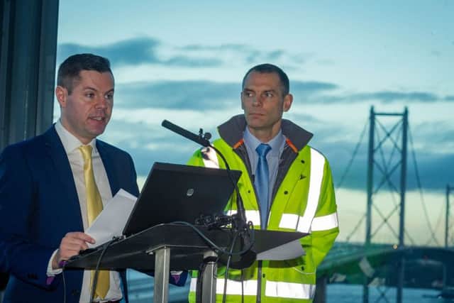 Transport Minister Derek Mackay with Chartered Engineet Mark Arndt announces the reopening of the Forth Road Bridge. Picture: Steven Scott Taylor