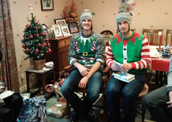 Jamie and Andy Murray open their gifts on Christmas. Picture: Twitter/Judy Murray
