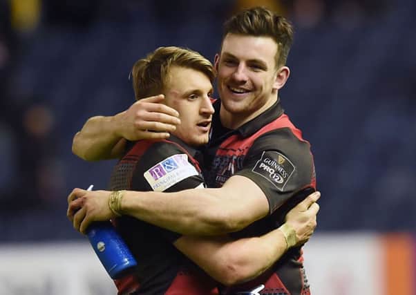 Tom Brown celebrates with Matt Scott at the end of the first leg, but the wing won't be fit for the return match. Picture: SNS