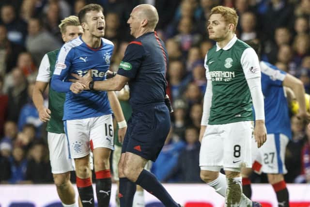 Fraser Fyvie, right, was involved in an altercation with Andy Halliday during Hibs' 4-2 defeat by Rangers. Pic: John Devlin