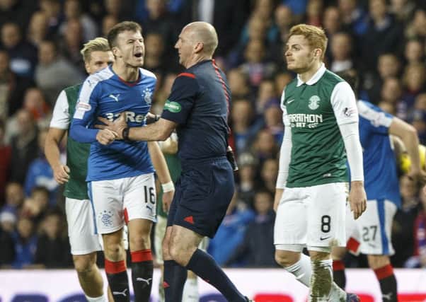 Fraser Fyvie, right, was involved in an altercation with Andy Halliday during Hibs' 4-2 defeat by Rangers. Pic: John Devlin