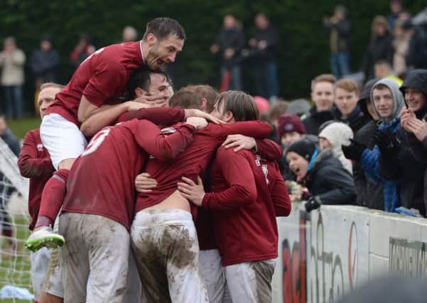 The jubilant Rose players celebrate Graham Weirs equaliser. Pic: SNS