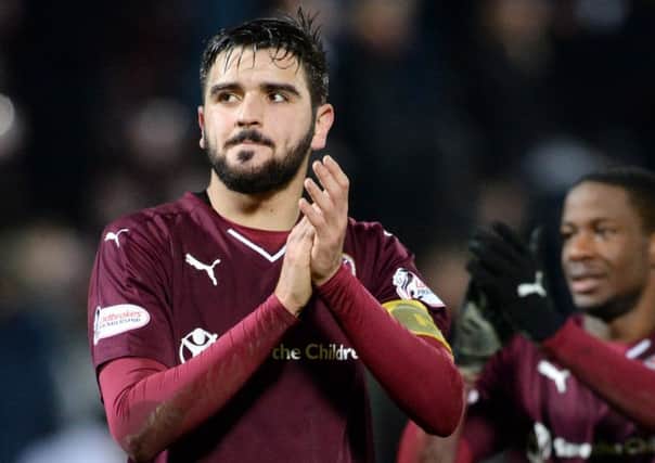 Alim Ozturk battled through the pain barrier as Hearts held off Aberdeen at Tynecastle