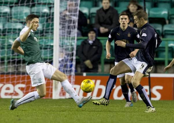 Paul Hanlon and Aaron Muirhead vie for possession during Hibs and Falkirks 1-1 draw last month. The two meet again this weekend. Pic: SNS