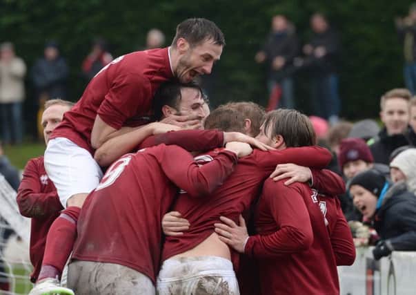Ally Adams, below, insists Linlithgow must put their current run in the William Hill Scottish Cup to the back of their minds when they host Irvine Meadow in the Junior Cup tomorrow