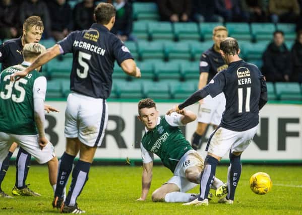 John McGinn was sent off for this challenge on Mark Kerr but successfully appealed his first-ever red card. Pic: Ian Georgeson