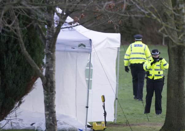 Police watch over a forensic tent. Pic: Ian Rutherford