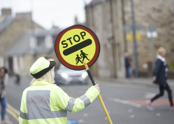 Plans to cut lollipop patrols have been axed. File picture: Greg Macvean