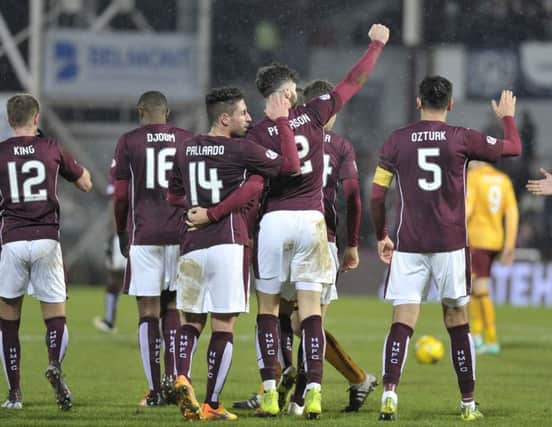 Hearts players celebrate after mauling Motherwell. Pic: Ian Rutherford