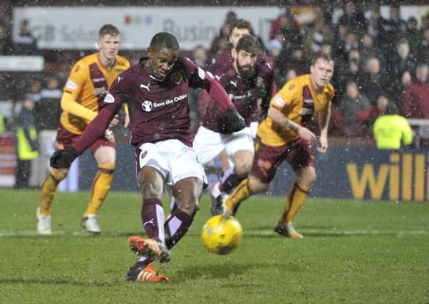Arnaud Djoum converts his penalty against Motherwell. Pic: Ian Rutherford