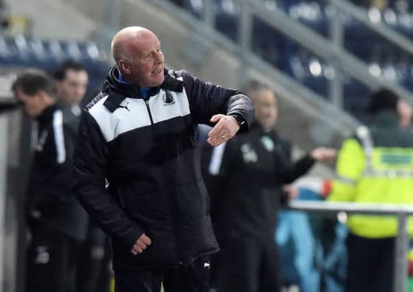 Falkirk manager Peter Houston had accused Hibs midfielder John McGinn of "going down too easily". Pic: SNS