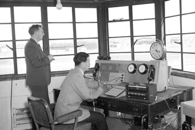 Air traffic controllers check their equipment in the airfields control tower 
in 1961 Picture: TSPL