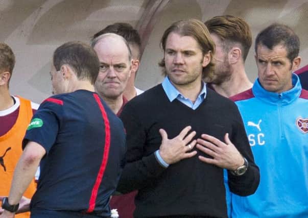 Hearts manager Robbie Neilson argues with officials in the dugout at Hamilton in August
