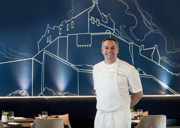 Dominic Jack

 with his restaurant's new mural. Picture: Contributed