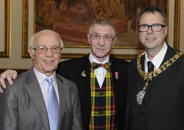 Ken Buchanan, centre, with Willie Henderson and Lord Provost Donald Wilson. Picture: Neil Hanna