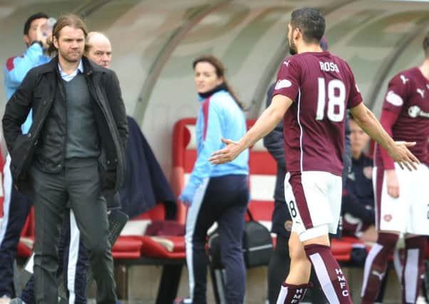 Igor Rossi protests his innocence to Hearts boss Robbie Neilson after being sent off for a two-footed tackle on Darren Lyon.   Picture: Ian Rutherford