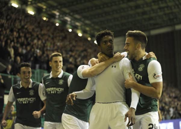 The Hibs players hail Dominique Malonga after his goal against Aberdeen last September. Pic: Andrew O'Brien