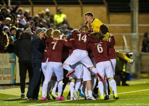 Linlithgow's players celebrate after defeating Forfar. Pic: SNS