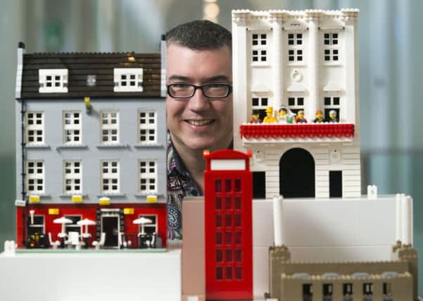 Warren Elsmore with his Lego Edinburgh tenement. Picture: Andrew O'Brien