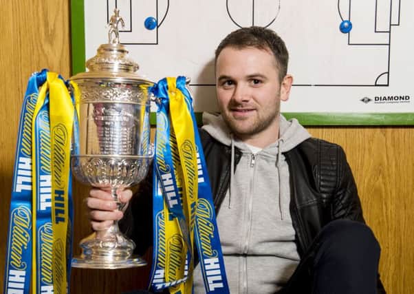 Linlithgow striker Colin Strickland gets a close look at the Scottish Cup