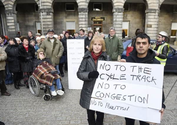 Roseburn residents Judy Probert and Sahin Katil gather with other protesters at City Chambers. Picture: Greg Macvean