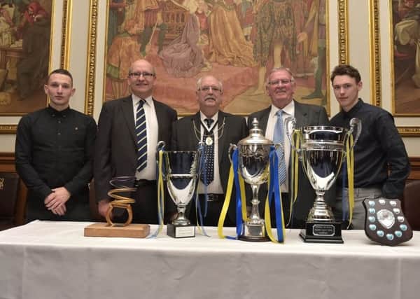 Edinburgh Monarchs were accorded a civic reception after winning two Premier League titles in a row amongst a haul of several speedway trophies in recent seasons. Riders Craig Cook, far left, and Max Clegg, far right, are pictured at the City Chambers with promoter John Campbell, team manager Alex Harkess and Bailie Norman Work. Pic: Ron MacNeill