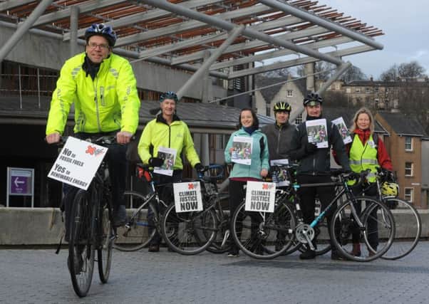 A team of cyclists from Stop Climate Chaos Scotland rode to the Scottish Parliament and around Edinburgh to deliver the campaign's Scottish Parliament manifesto. Picture: Esme Allen