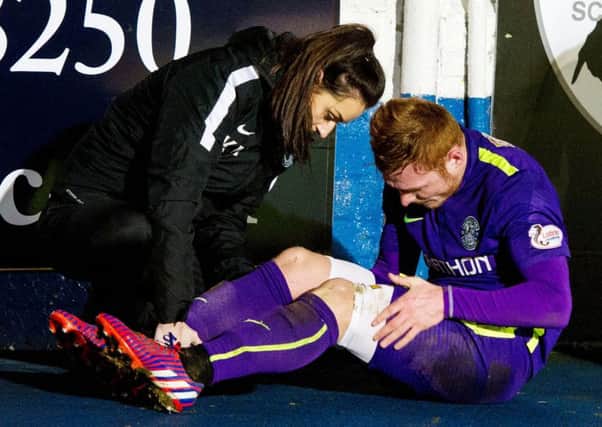 Fraser Fyvie receives treatment at Cappielow on Tuesday night