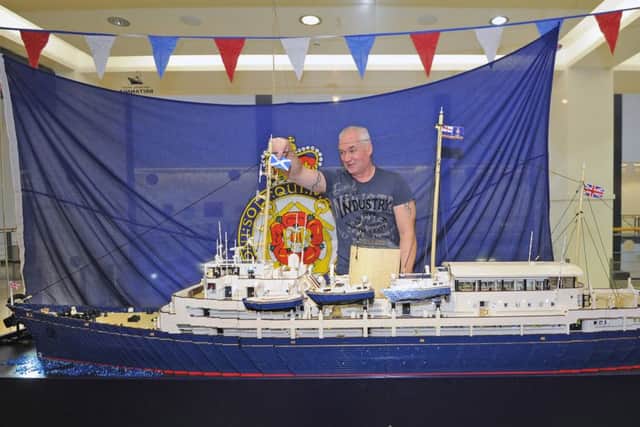 LEGO model builder Jim McDonough puts the finishing touches to his model. Picture: Neil Hanna