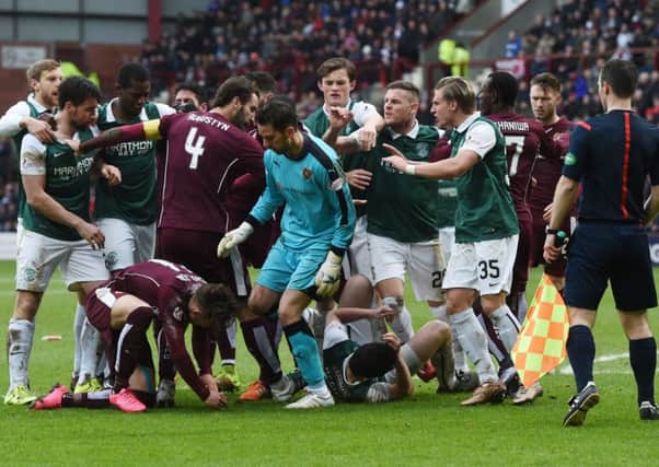 Things boil over between Hearts and Hibs players. Picture: SNS