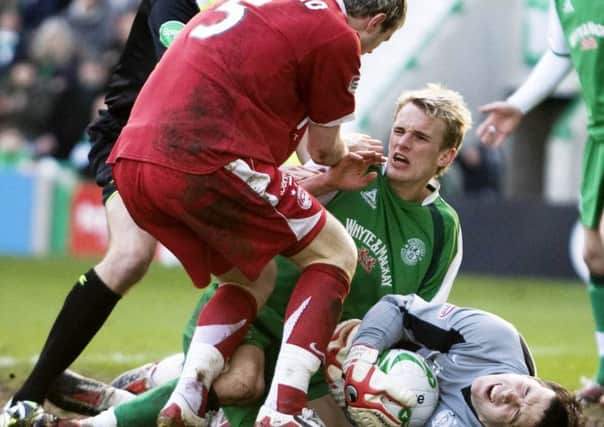 Zander Diamond confronts Dean Shiels after the Hibs player challenged for a ball with Jamie Langfield