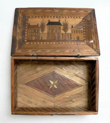 A wooden box, probably made by a prisoner of war held at one of the Napoleonic camps at Penicuik