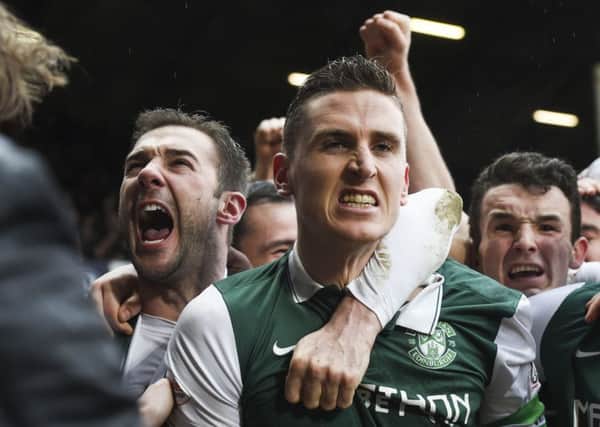 Paul Hanlon is joined by his team-mates after scoring Hibs' equaliser against Hearts. Pic: SNS