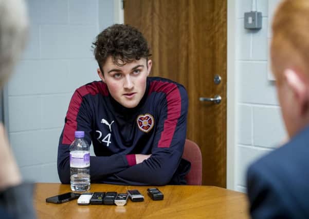 John Souttar believes he will improve as a player at Hearts. The defender is set to make his debut against Ross County tonight. Pic: SNS