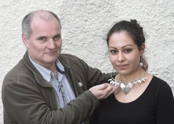 Gulf War veteran Joe Sangster with Beatriz Tellez, who is modelling one of his necklaces. Picture: Greg Macvean