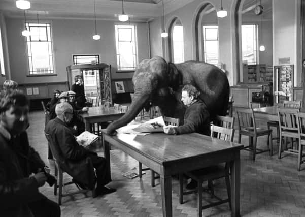 Indras the elephant visits Leith Public Library as part of a campaign to remind people to return their books in January 1976, with the man on the left seemingly determined to pretend nothing unusual is happening. Picture: George Smith