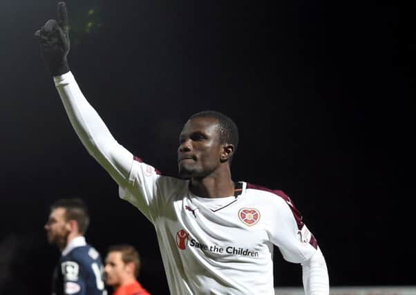 Abiola Dauba got off the mark for Hearts with a double against Ross County