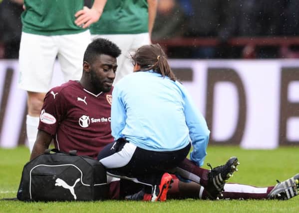 Prince Buaben receives treatment during Hearts 2-2 draw with Hibs last weekend in the Scottish Cup. Pic: SNS