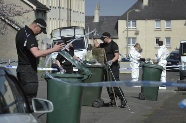 Police search for evidence in Wardieburn Place. Picture: Scott Taylor