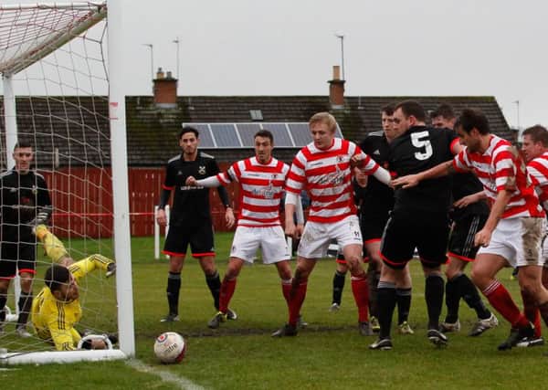 A host of Bonnyrigg players are unable to force the ball into the Pollok net. Pic: Scott Louden
