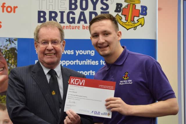 Callum Marshall was presented with his certificate by the Very Reverend Andrew McLellan. Picture: supplied
