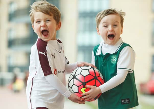 Hearts fan Lewis King and cousin Evan Allan get ready for last night's derby clash. Picture: Toby Williams