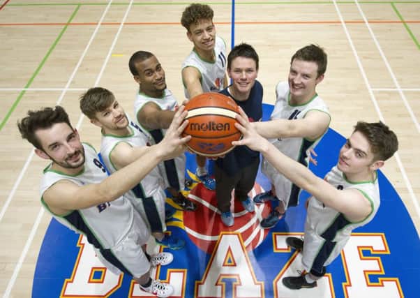 Coach Simon Turner, in blue, with Boroughmuir Blaze players, from left, Sean Cole, Eoghann Dover, John Browne, Sean Nealon-Lino, Lewis Crofts and Sam Stott. Pic: Ian Rutherford