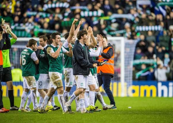 Hibs celebrate their 1-0 win over Hearts at full-time. Pic: Ian Georgeson