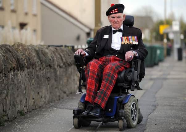 Tom Gilzean needs some help to fix his disability scooter. Picture: Jane Barlow
