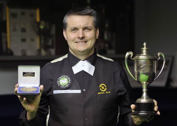 Craig MacGillivray shows off the East of Scotland Snooker trophy. Pic: Ian Rutherford