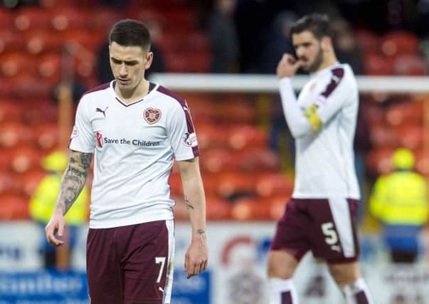Dejection for Hearts' Jamie Walker at full-time. Picture: SNS