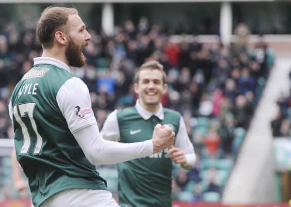 Martin Boyle celebrates scoring the first goal against the Wasps as he set Hibs on the way to a vital three points. Picture: Greg Macvean