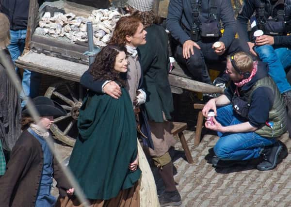 Scots actor Sam Heughan and co-star Caitriona Balfe on the set of Outlander in Dysart in Fife. Picture: Steve Brown