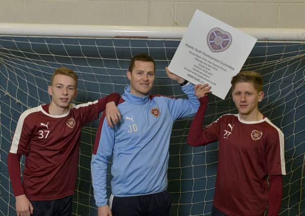 Hearts players Lewis Moore, left, and Robbie Buchanan joined Under-20 coach Jon Daly to promote the awards dinner. Pic: Julie Bull